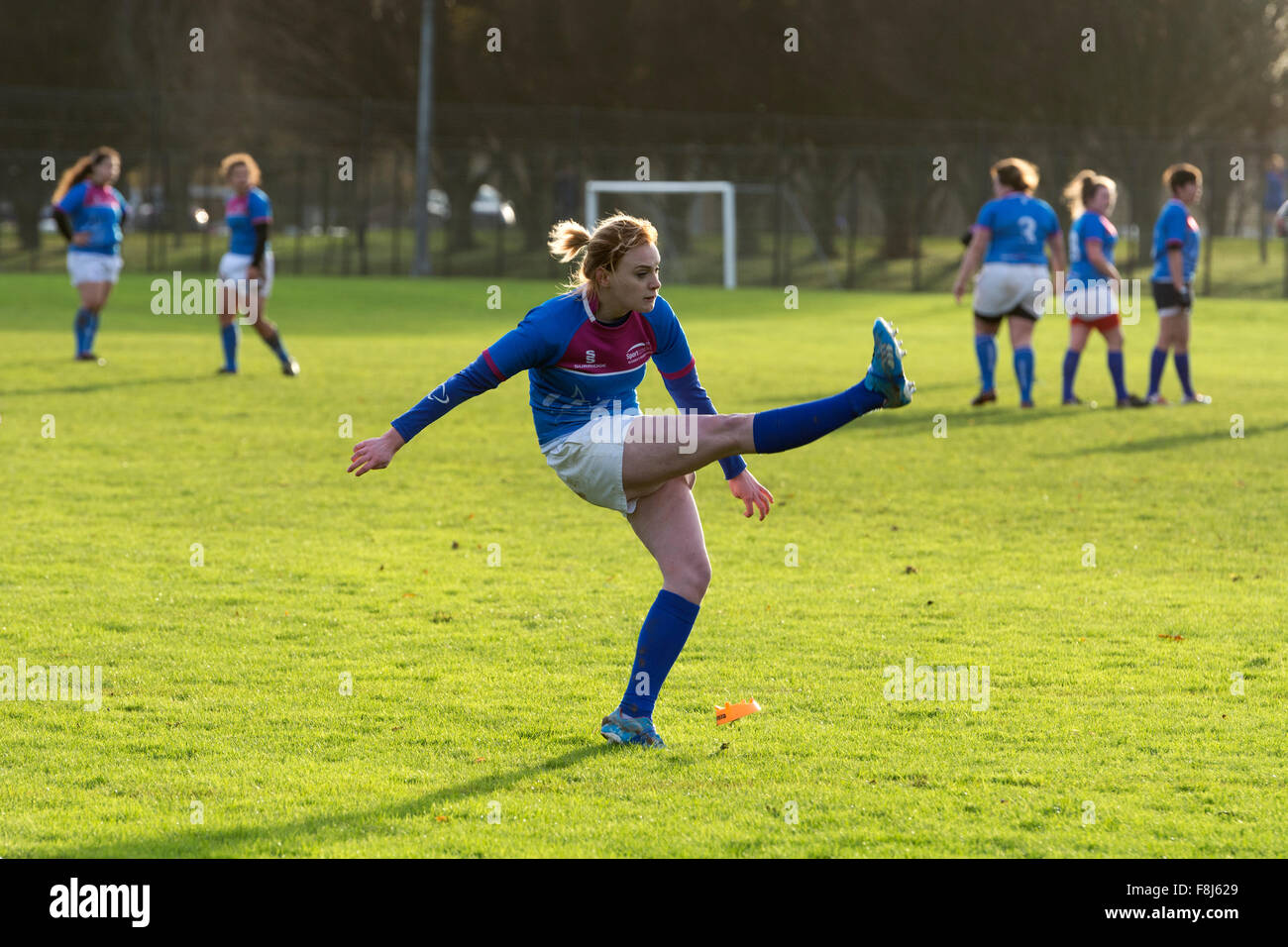University sport UK women`s Rugby Union, player kicking a conversion